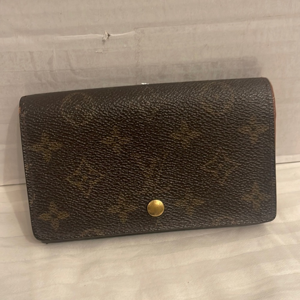 Monogram wallet with minor wear inside good condition outside